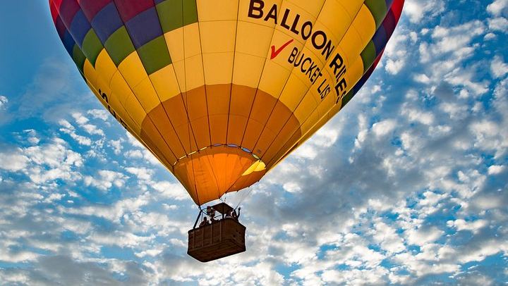 Balloon in the sky during sunrise.