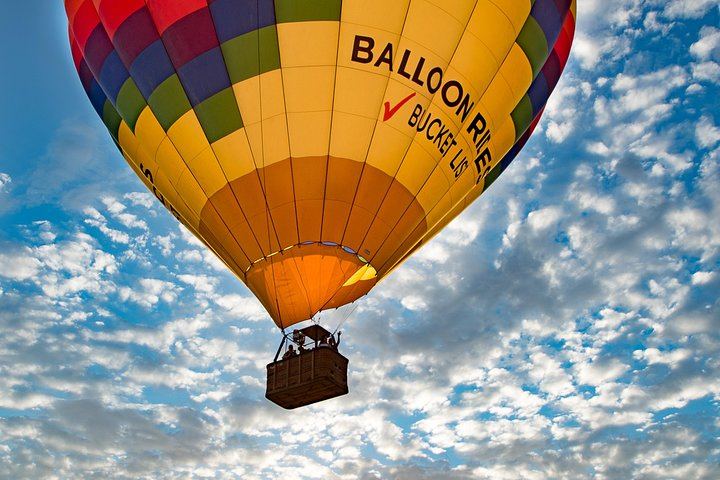 Balloon in the sky during sunrise.