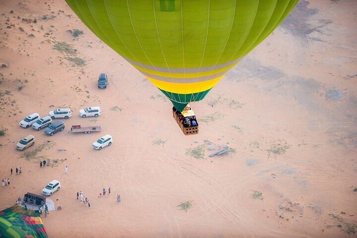 Drifting peacefully over endless dunes — discover the breathtaking charm of the Dubai desert from a hot air balloon.