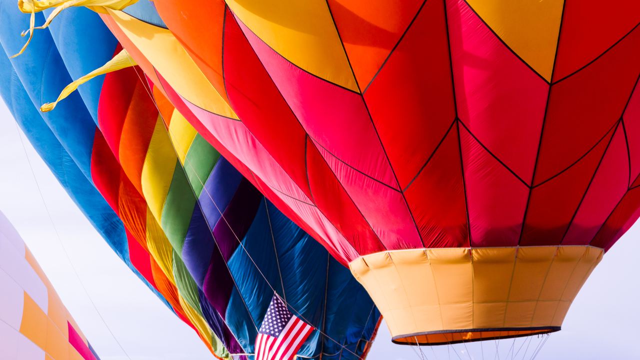 Hot air balloons inflating at the annual balloon festival in Erie, Colorado