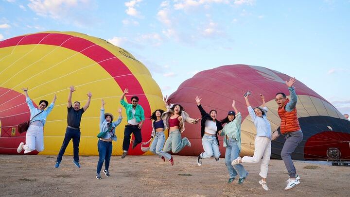Jumping for joy over their hot air balloon flight