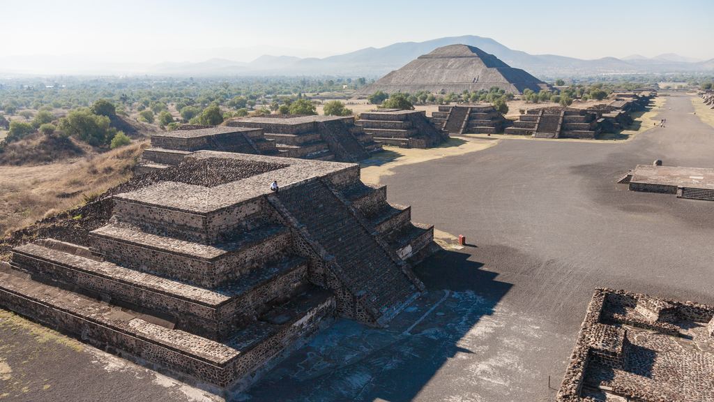 The empty Avenue of the Dead at Teotihuacan leading north to the Pyramid of the Moon in early morning light