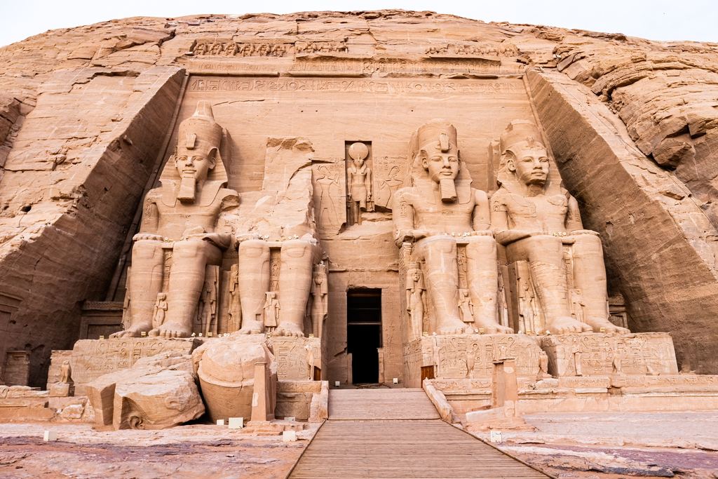 The four seated colossi of Ramesses II at the entrance to the Great Temple at Abu Simbel, the second from the left broken above the waist.