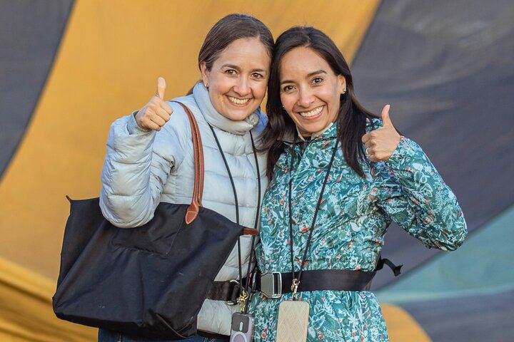 Two adventurers, ready for the skies! Excitement builds as they prepare to soar over the Serengeti with Miracle Experience.