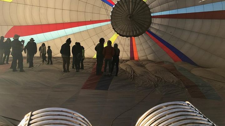 Walk inside the hot air balloon as it inflates.